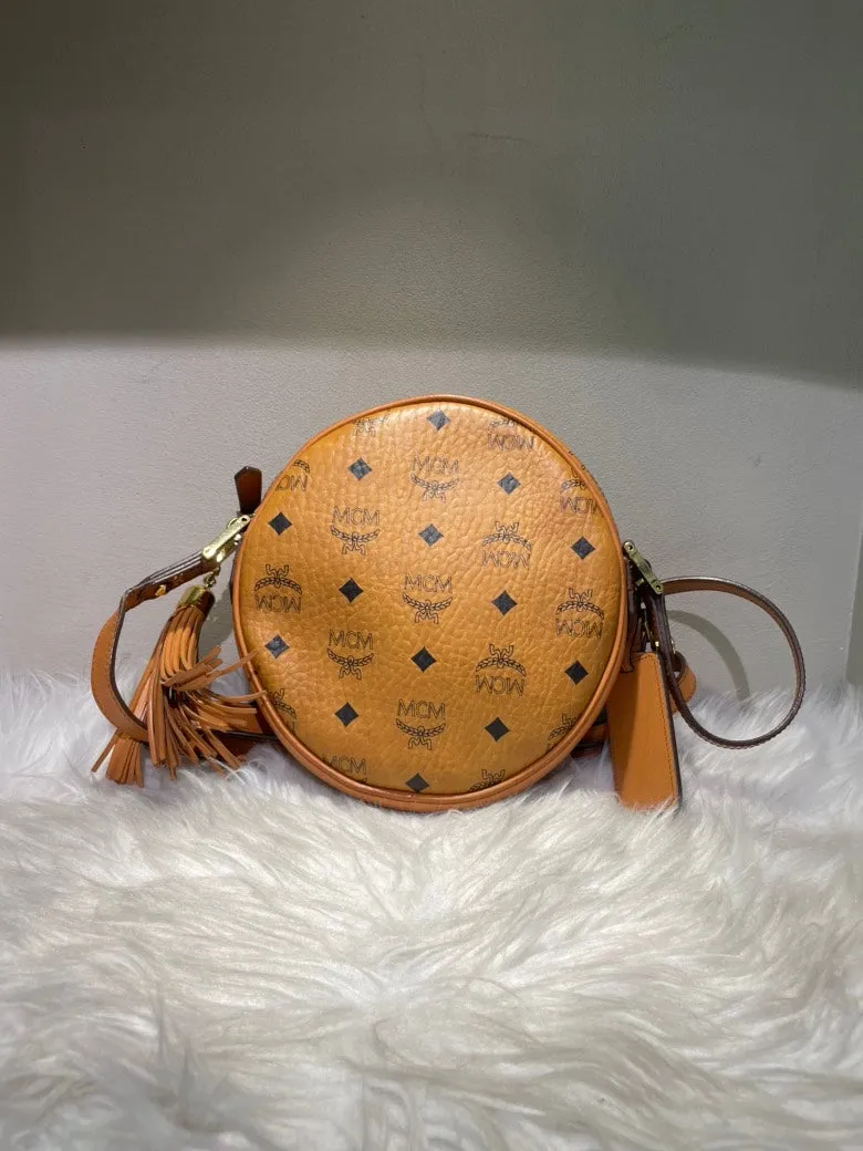 MCM Pre-Loved Visetos Leather Round Crossbody Bag in Cognac